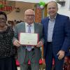Bro. Larcher receives his diploma.